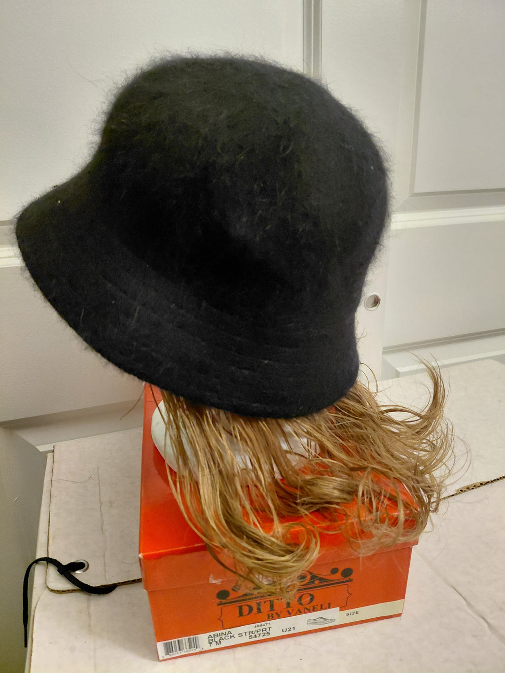Black Bucket hat with Short Blonde hair