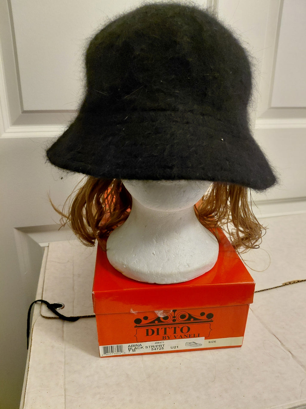 Black Bucket hat with Short Blonde hair