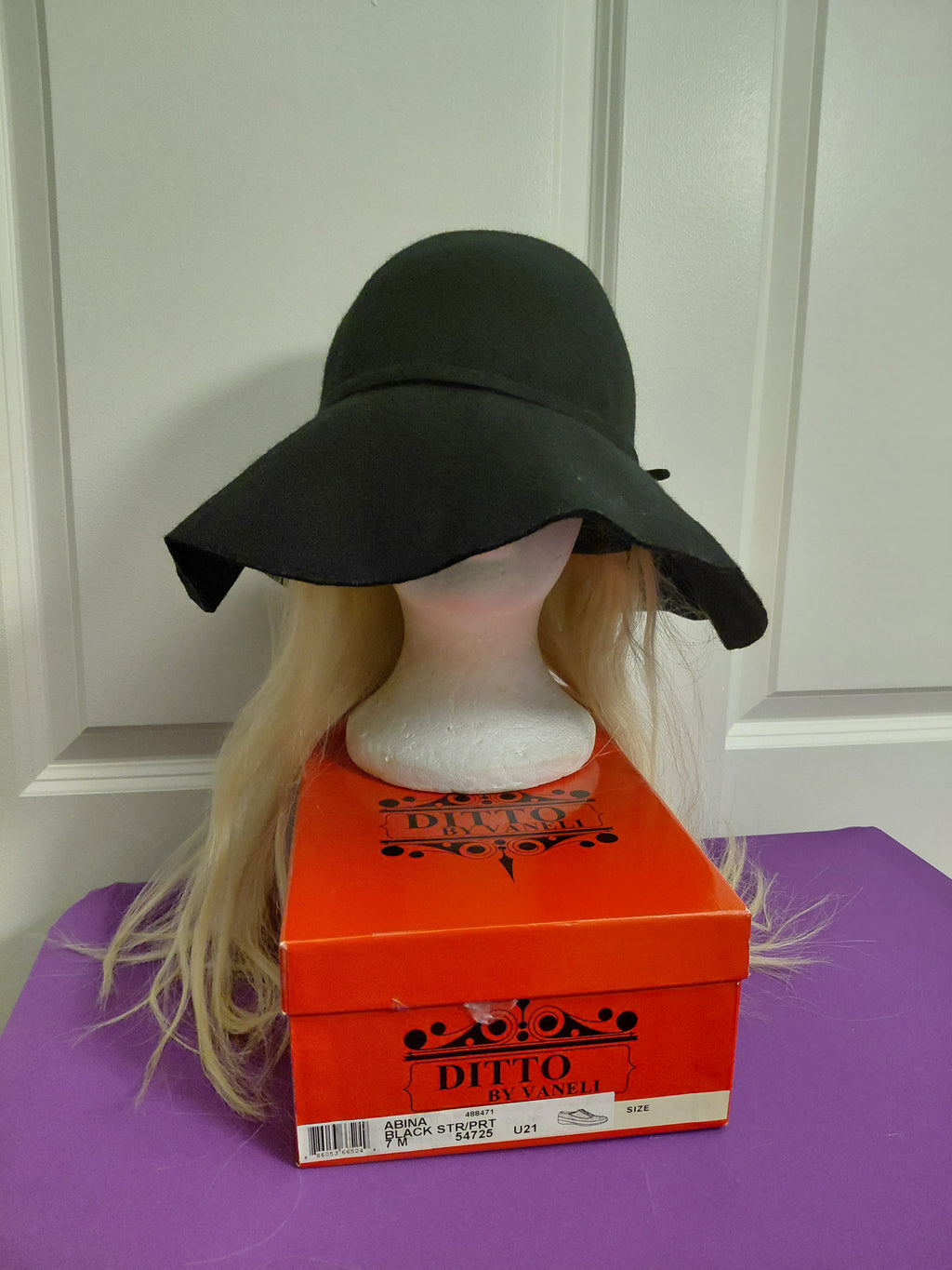Black Floppy hat with Blonde Hair
