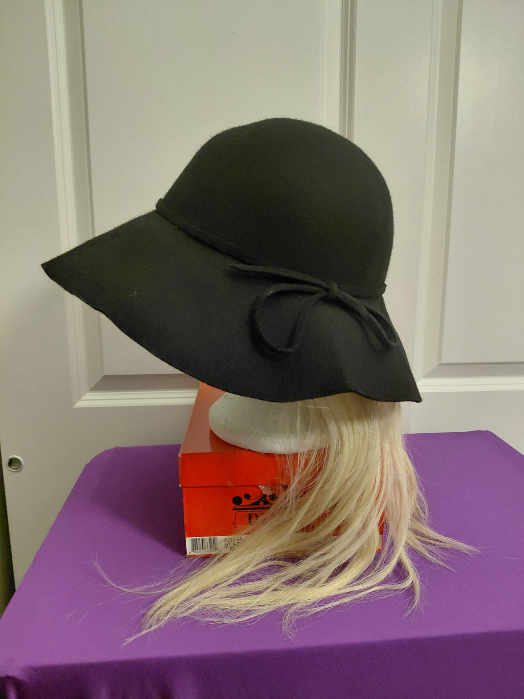 Black Floppy hat with Blonde Hair