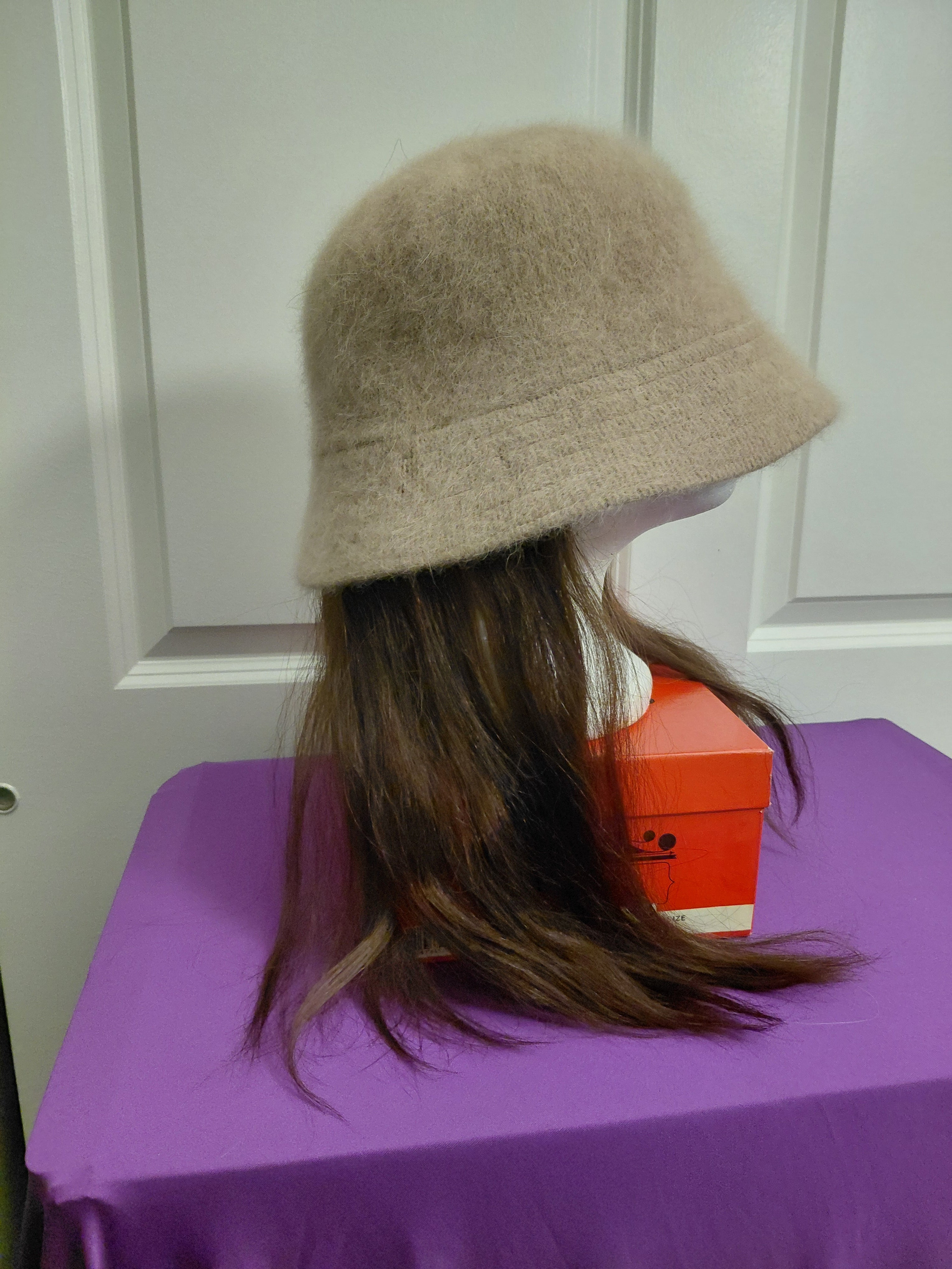 Tan Bucket hat with brown hair