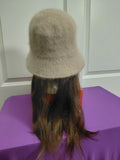 Tan Bucket hat with brown hair