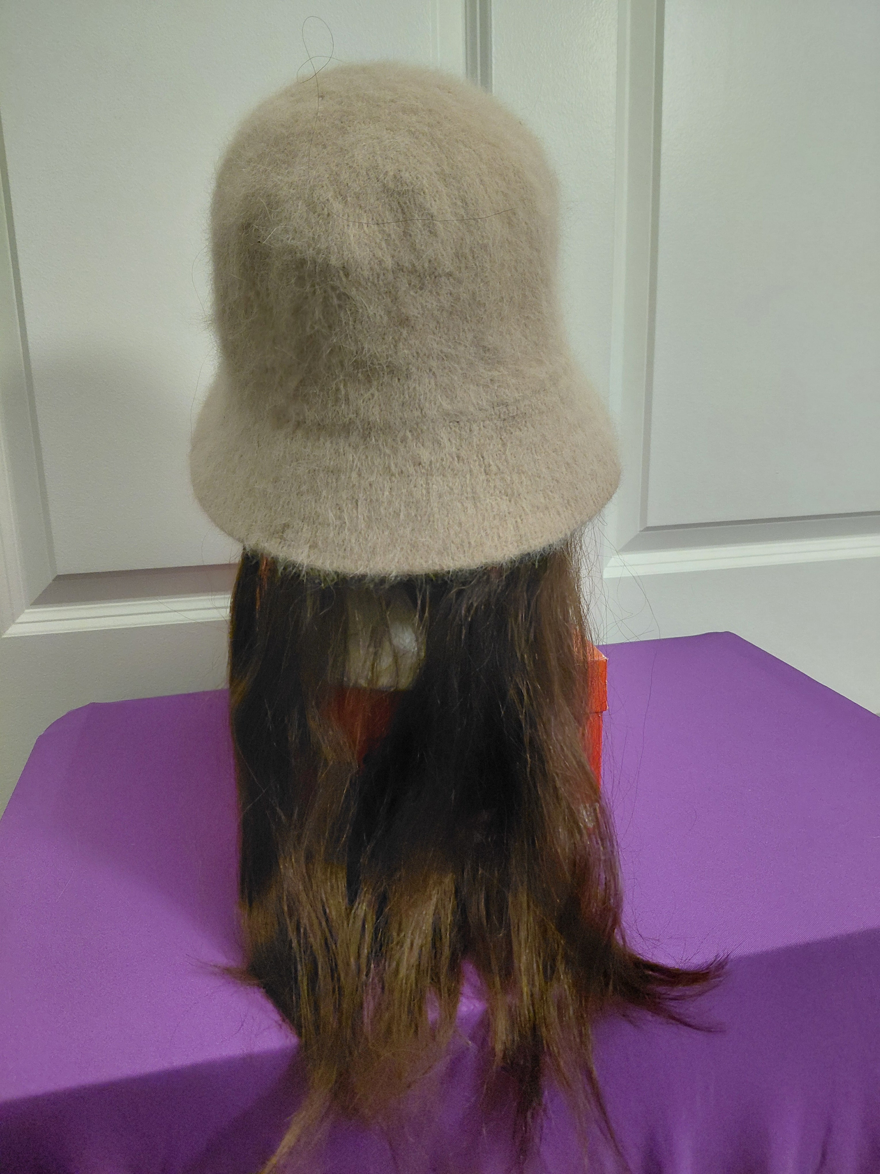 Tan Bucket hat with brown hair