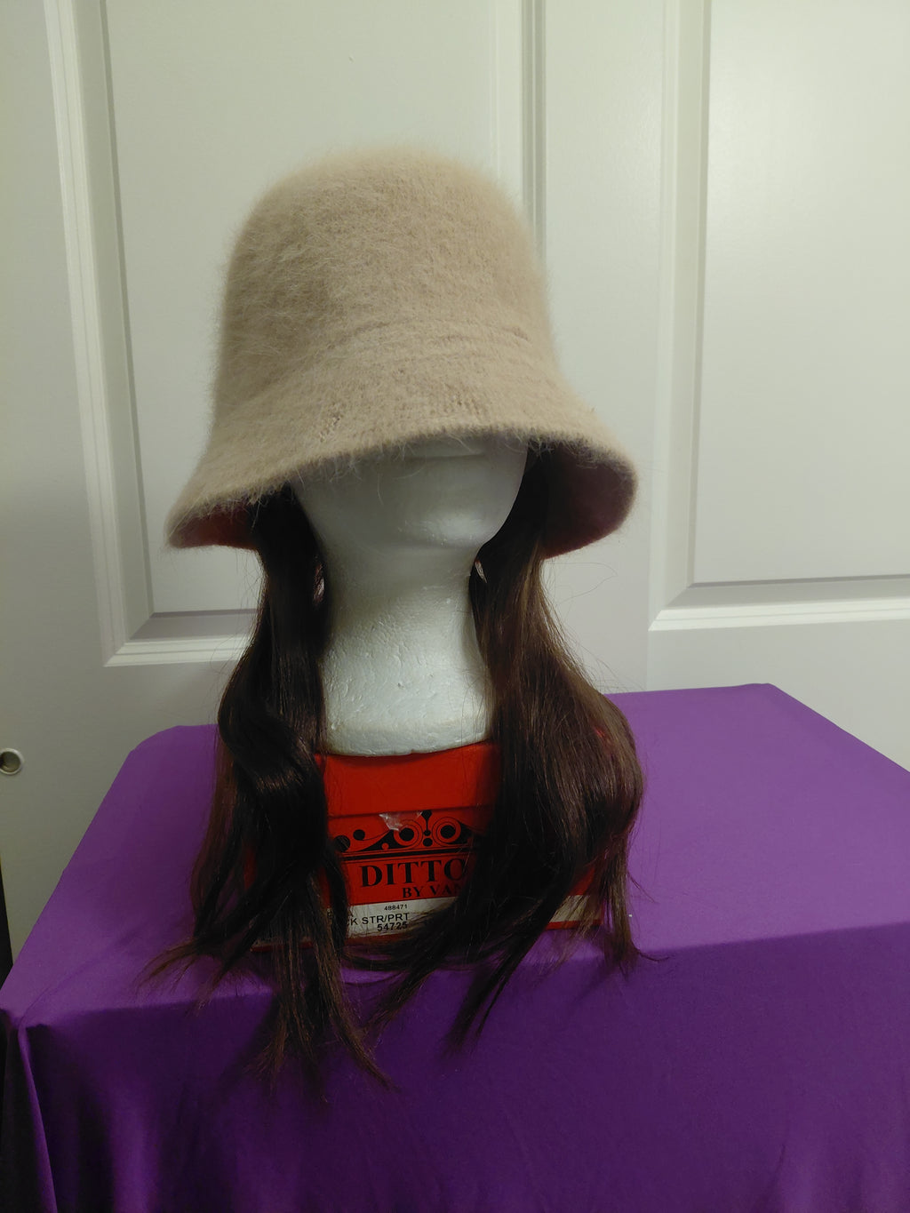 Tan Bucket hat with dark brown hair