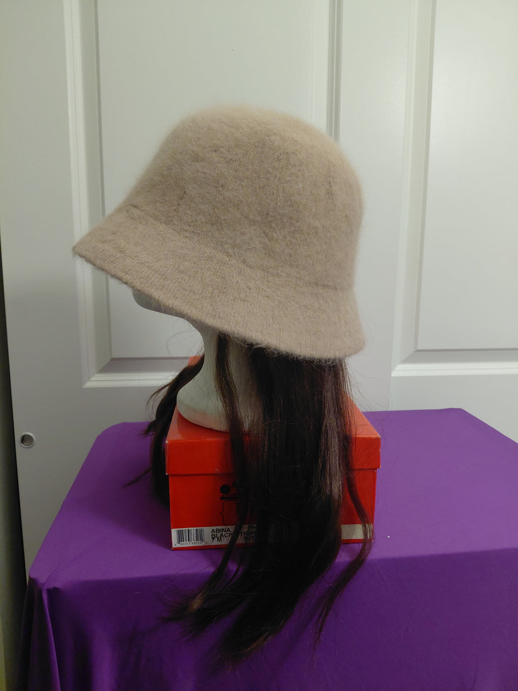 Tan Bucket hat with dark brown hair