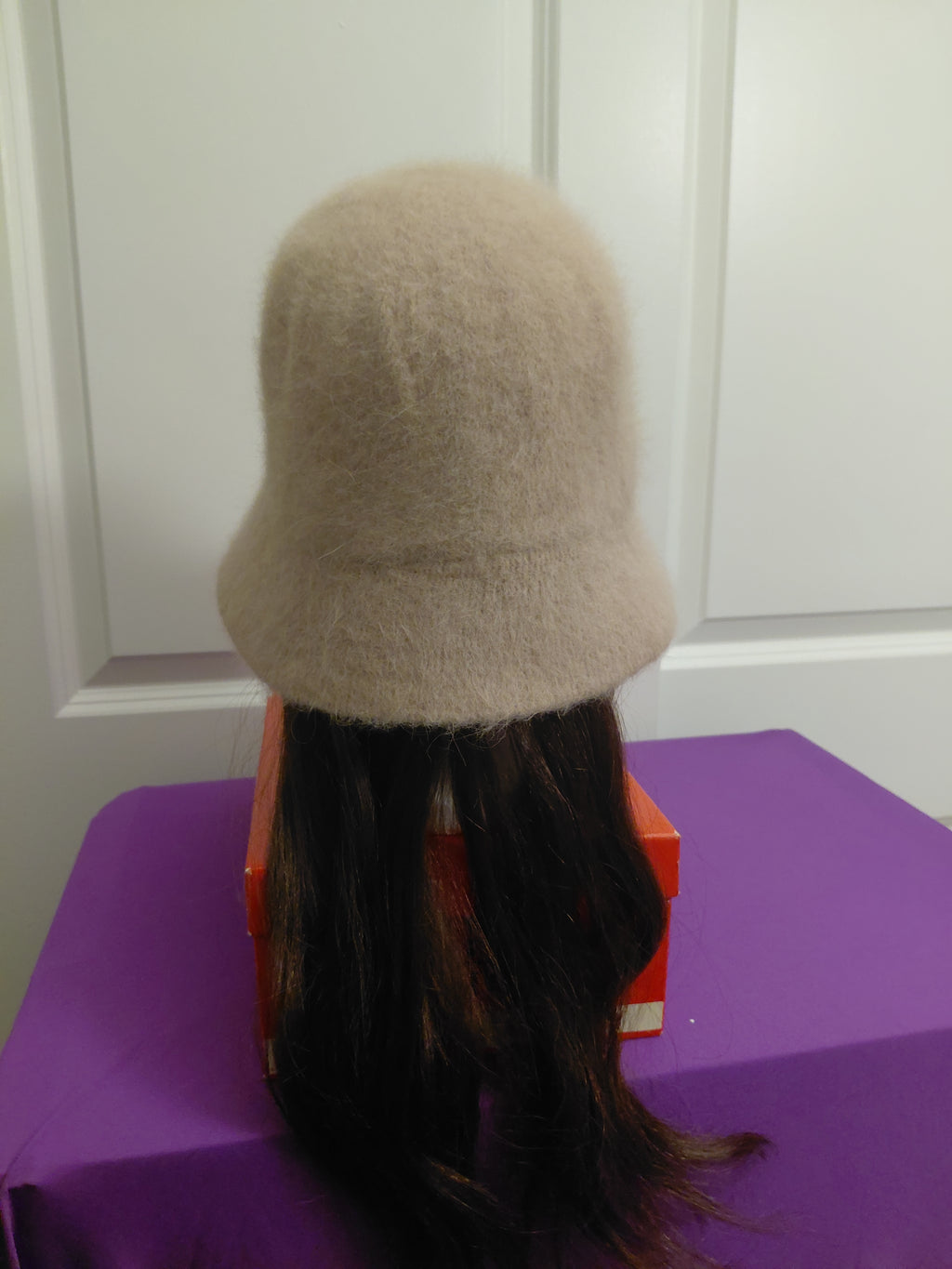 Tan Bucket hat with dark brown hair