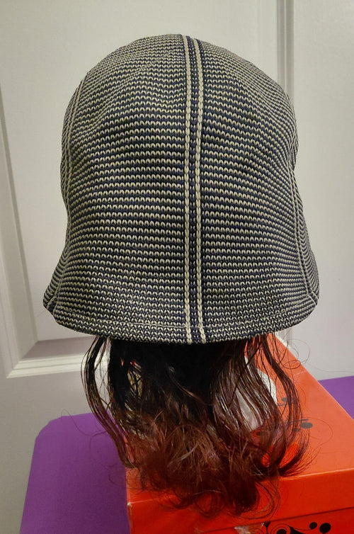 Black and White hat with Bergundy and black hair