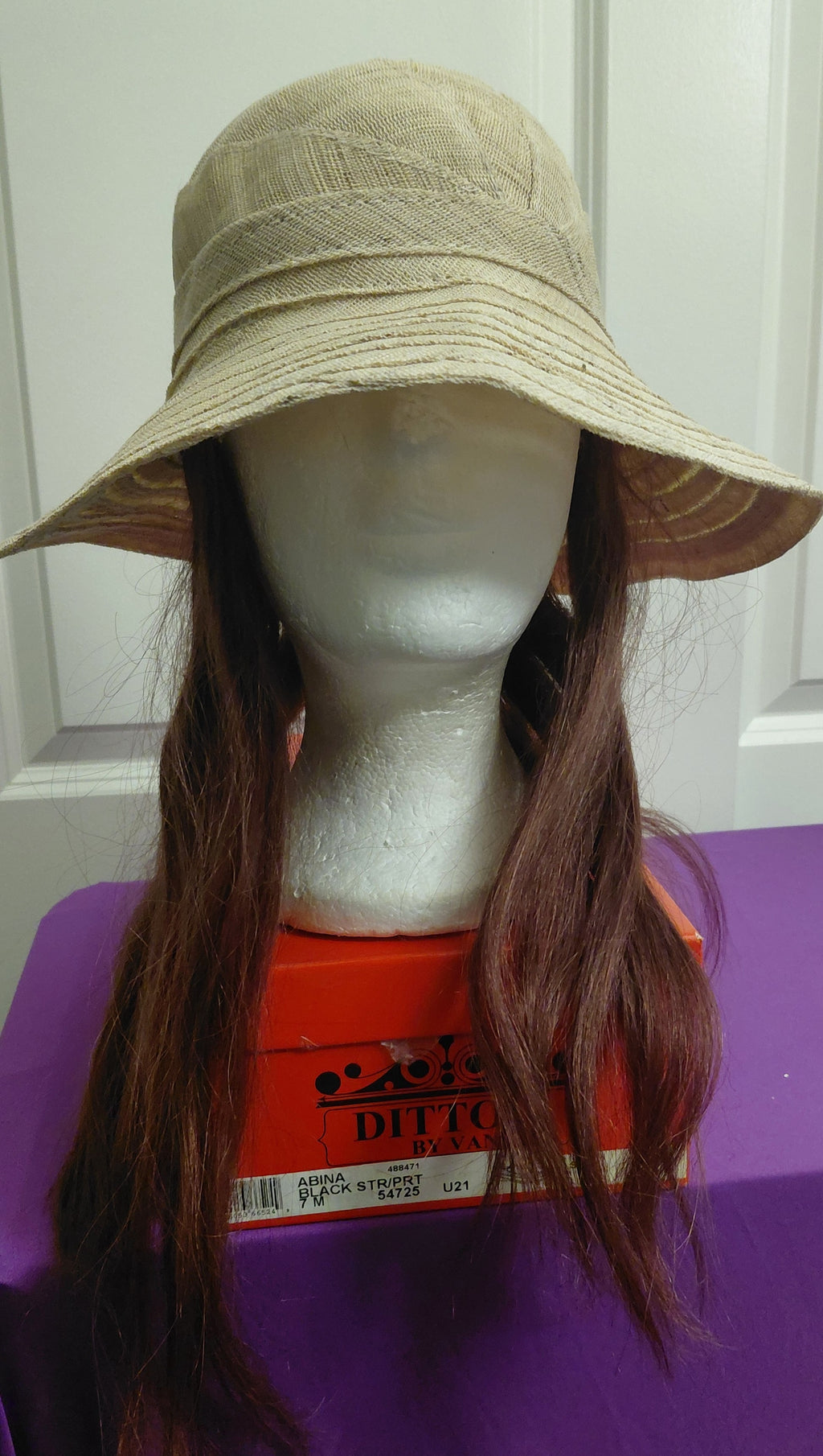 Tan canvas hat with Brown hair