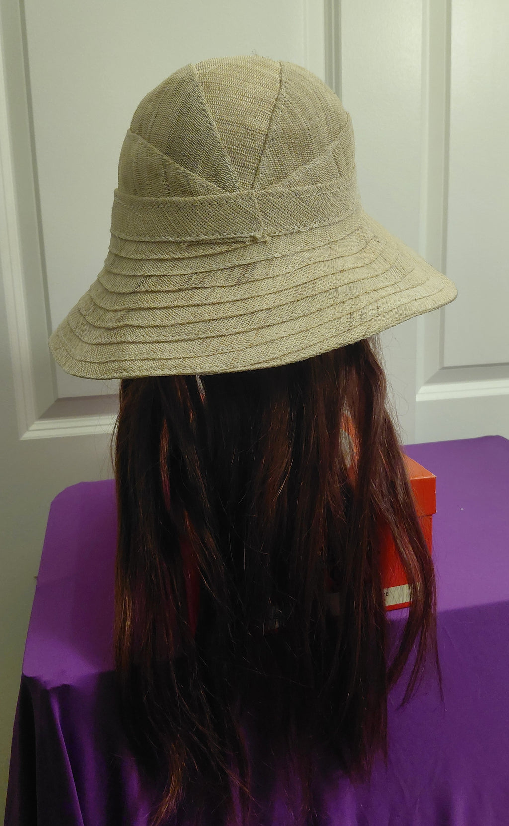 Tan canvas hat with Brown hair
